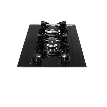Black Vox built-in gas cooktop with two burners and mechanical control knobs on a sleek glass surface
